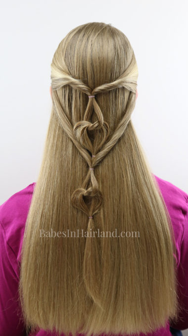 Love is in the Hair with this cute Valentine's Day hairstyle from BabesInHairland.com. This hanging hearts hairstyle is one everyone will love! #hair #hairstyle #heart #hearts #valentinesday #love #valentinesdayhairstyle #hearthairstyle