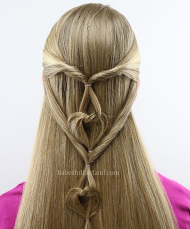 Love is in the Hair with this cute Valentine's Day hairstyle from BabesInHairland.com. This hanging hearts hairstyle is one everyone will love! #hair #hairstyle #heart #hearts #valentinesday #love #valentinesdayhairstyle #hearthairstyle