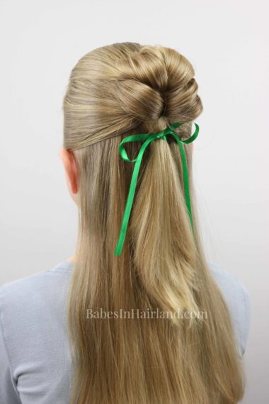 This is the cutest 4 leaf clover hairstyle for St. Patrick's Day I've seen in a long time!  BabesInHairland.com has a fast and easy tutorial for this lucky hairstyle! #hair #hairstyle #shamrock #stpatricksday #lucky #4leafclover #4leafcloverhairstyle