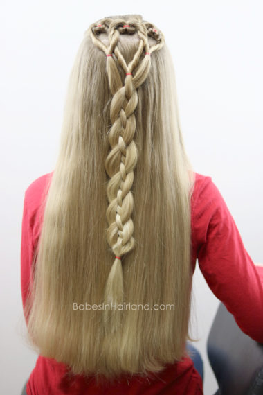 Three hearts are better than one! We love this twisted heart and 4 strand braid hairstyle from BabesInHairland.com. It's perfect for school Valentine's Day parties. hair | braids | love