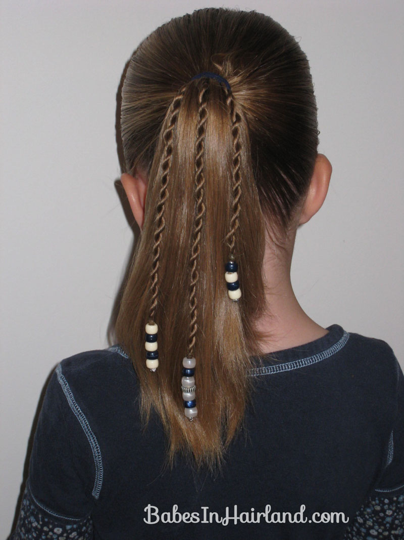 Beads in boy's hair?