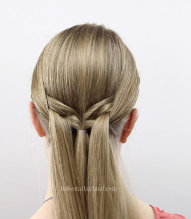 If you need a beautiful hairstyle that is easy and fast, this woven knot braid tutorial will have you out the door in 5 minutes. BabesInHairland.com