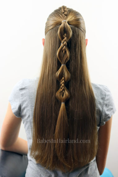 Combine a cool Dutch braid and bubble ponytail to create this edgy Peek-a-Boo French Braid hairstyle. BabesInHairland.com 