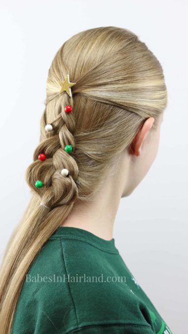 Everyone girl needs a cute hairstyle for Christmas. Try this pretty Mermaid Braid Christmas Tree from BabesInHairland.com. It's perfect for your Christmas plans and school. #hair #hairstyle #Christmashair #Christmastree #Christmashairstyle #mermaidbraid #braid #beauty #frenchbraid #dutchbraid