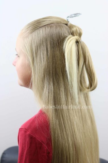 This darling angel ponytail hairstyle will have you singing "Angels We Have Heard on HAIR" this Christmas seasons! Try this cute hairstyle for Christmas this year from BabesInHairland.com #hairstyle #hair #ponytail #christmashairstyle #angel #christmas