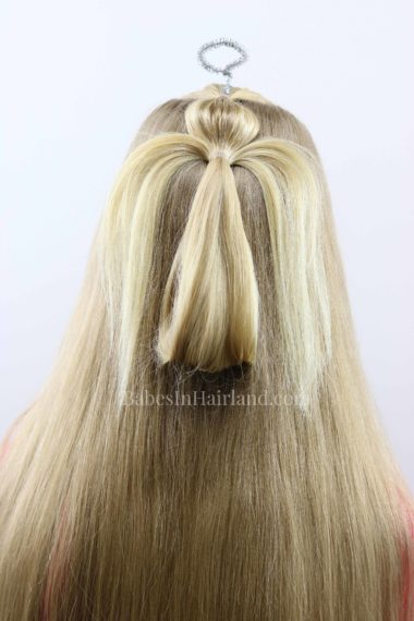 This darling angel ponytail hairstyle will have you singing "Angels We Have Heard on HAIR" this Christmas seasons! Try this cute hairstyle for Christmas this year from BabesInHairland.com #hairstyle #hair #ponytail #christmashairstyle #angel #christmas