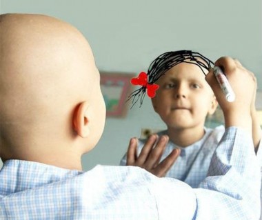 Little Cancer Patient Coloring on Hair in Mirror