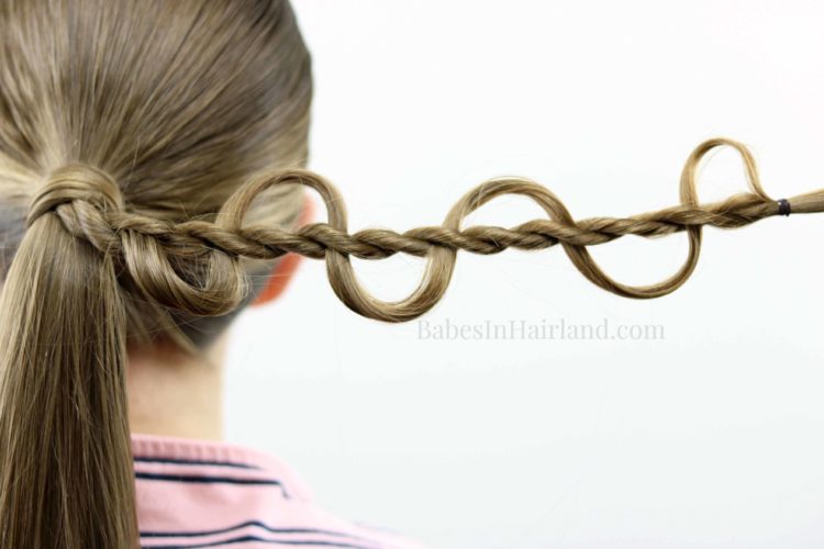Dress up your ponytail with this cool weaving twist from ...